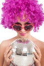 Beautiful young girl with pink wig holding disco ball,isolated Royalty Free Stock Photo