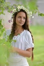 Beautiful young girl with plaits and daisies Royalty Free Stock Photo