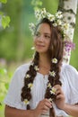 Beautiful young girl with plaits and daisies Royalty Free Stock Photo