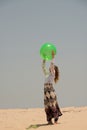 Beautiful young girl playing with a ball