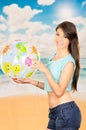 Beautiful young girl playing with beach ball Royalty Free Stock Photo