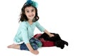 Beautiful young girl playing with black labrador puppy Royalty Free Stock Photo