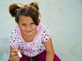 Beautiful young girl playing with sidewallk chalk.