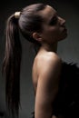 Beautiful young girl, with ponytail, in shallow focus, artistic Royalty Free Stock Photo