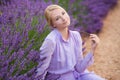 Beautiful young girl in provence lavender field background in valensole