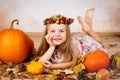 Beautiful young girl with pumpkins Royalty Free Stock Photo