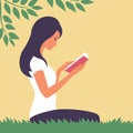 Beautiful young girl reads a book in nature Royalty Free Stock Photo