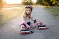 Beautiful young girl resting after rollerblading in the park Royalty Free Stock Photo