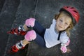 Beautiful young girl resting after rollerblading in the park Royalty Free Stock Photo
