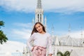 Young girl at the River Boulevard in front of the famous gothic church of La Ermita built on 1602 in the city of Cali Royalty Free Stock Photo
