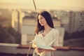 Beautiful young girl at the roof with origami paper crane Royalty Free Stock Photo