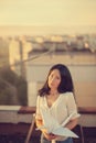 Beautiful young girl at the roof with origami paper crane in hands Royalty Free Stock Photo