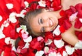 Beautiful young girl in rose petal Royalty Free Stock Photo