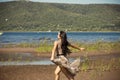 Beautiful young girl runs along the beach Royalty Free Stock Photo