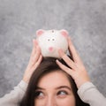 Beautiful young girl saving money for holiday season, saving Royalty Free Stock Photo