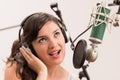 Beautiful young girl singing in music studio Royalty Free Stock Photo