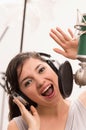 Beautiful young girl singing in music studio Royalty Free Stock Photo