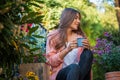 Taking a break and enjoying a caffee in the garden Royalty Free Stock Photo