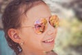 Beautiful young girl in sunglasses with beach reflection. Royalty Free Stock Photo