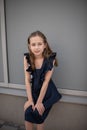 Beautiful young girl in vintage dress posing outdoors