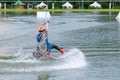 Beautiful young girl wakeboarding at lake Royalty Free Stock Photo