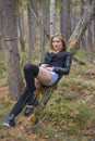 Beautiful young girl walking in the autumn forest. Royalty Free Stock Photo