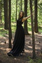 Beautiful young girl walking in a fairy forest. Royalty Free Stock Photo