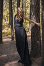 Beautiful young girl walking in a fairy forest.