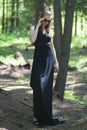 Beautiful young girl walking in a fairy forest. Royalty Free Stock Photo