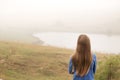 A girl in the fog by the lake Royalty Free Stock Photo