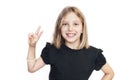 Beautiful young girl on white background with blond hair smiling and showing class with two fingers on a white background Royalty Free Stock Photo