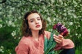 Beautiful young girl among white flowering trees . Royalty Free Stock Photo