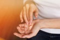 Beautiful young girl in white longsleeve moisturizes her hands with cream. Nails Applying Cosmetic Hand Cream On Soft Silky Royalty Free Stock Photo