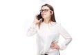 Beautiful young girl in a white shirt on white isolated background talking on a mobile phone. Smiles portrait to the Royalty Free Stock Photo