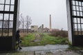 Beautiful young goth girl standing in abandoned factory building Royalty Free Stock Photo