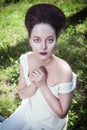 Beautiful young gothic woman in white shirt Royalty Free Stock Photo