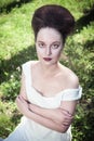 Beautiful young gothic woman in white shirt Royalty Free Stock Photo