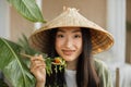 Beautiful young and happy asian woman eating healthy salad with fresh organic vegetables Royalty Free Stock Photo