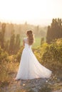 Beautiful young happy bride standing on the top of the mountain Royalty Free Stock Photo