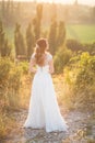 Beautiful young happy bride standing on the top of the mountain Royalty Free Stock Photo