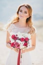Beautiful young happy bride standing on the top of the mountain Royalty Free Stock Photo