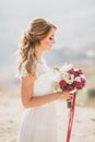 Beautiful young happy bride standing on the top of the mountain Royalty Free Stock Photo