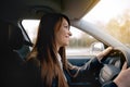 Beautiful young happy smiling woman driving her new car. Royalty Free Stock Photo