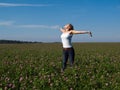 Beautiful young happy woman in a field Royalty Free Stock Photo