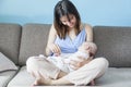 Beautiful happy young brunette woman with newborn baby on her hands, family happiness, love and care concept, mother day Royalty Free Stock Photo