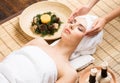 Beautiful, young and healthy woman on bamboo mat in spa salon ha Royalty Free Stock Photo