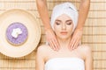 Beautiful, young and healthy woman on bamboo mat in spa salon ha Royalty Free Stock Photo