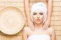 Beautiful, young and healthy woman on bamboo mat in spa salon ha Royalty Free Stock Photo