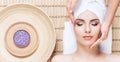 Beautiful, young and healthy woman in spa salon on bamboo mat. S Royalty Free Stock Photo