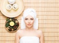 Beautiful, young and healthy woman in spa salon on bamboo mat. S Royalty Free Stock Photo